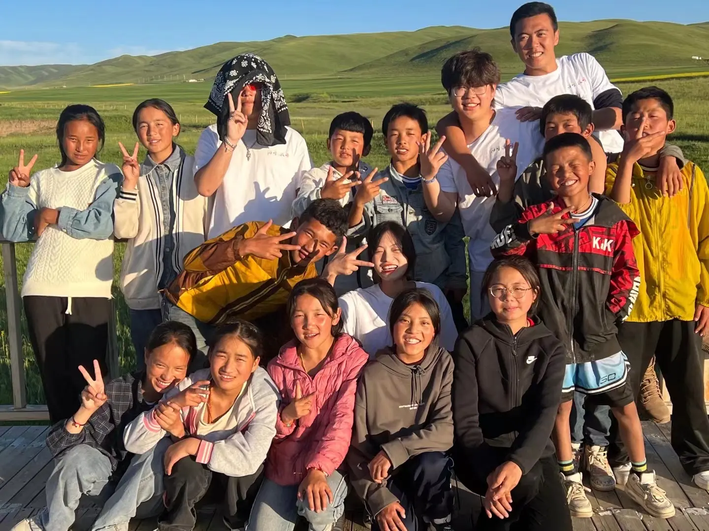 Xiao Chen with students during teaching in Tibet