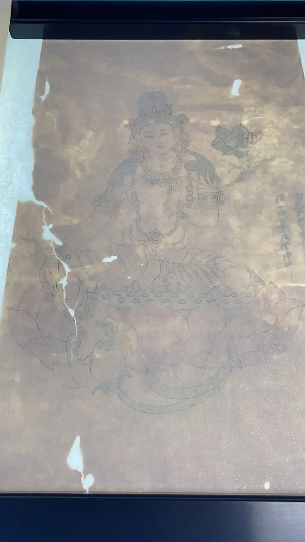 Detail of a historic painting under restoration