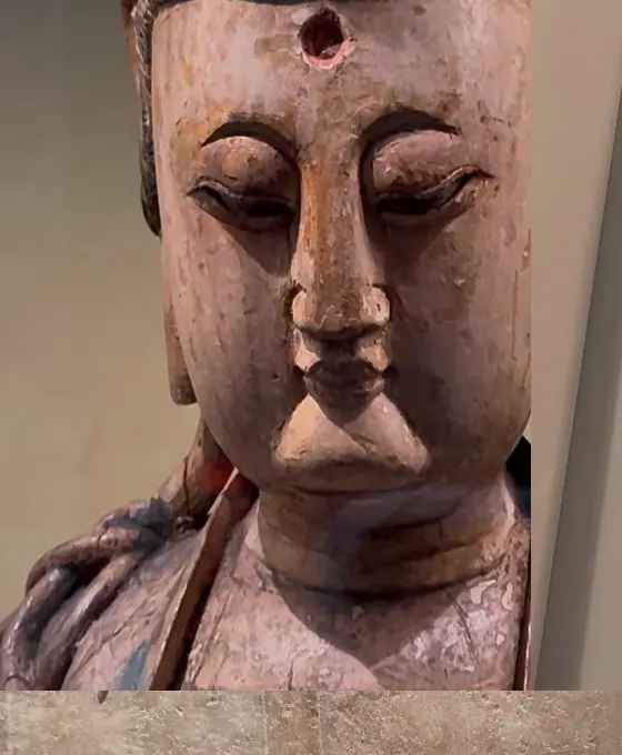 Wooden religious figure photographed in a museum