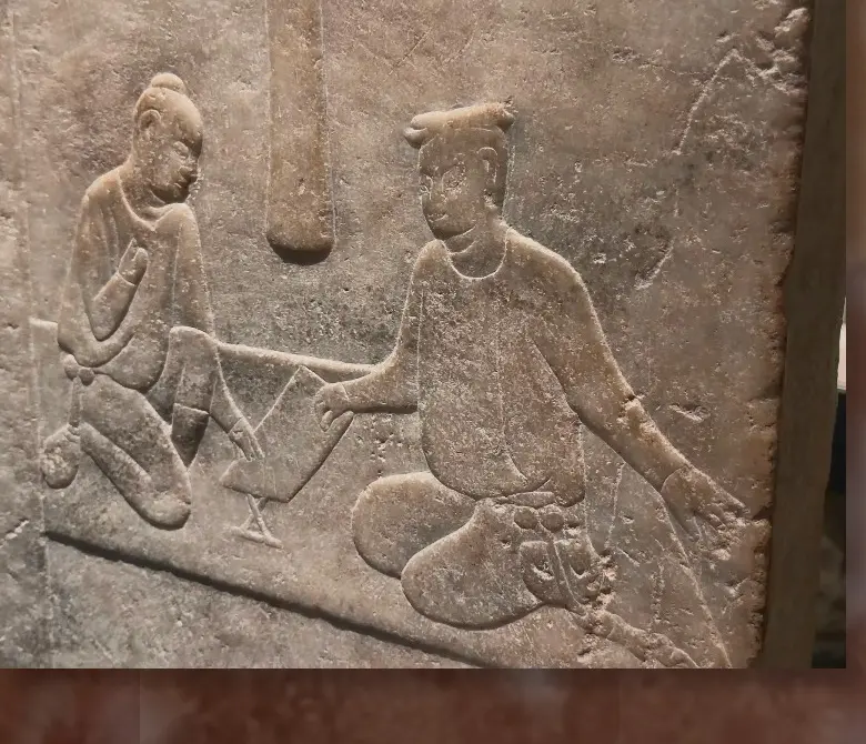 Carved stone relief photographed in a museum